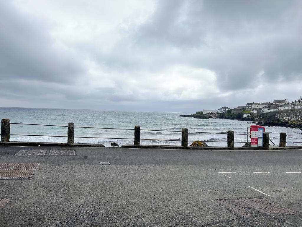 Lot: 101 - LAND IN EXTREMELY SOUGHT AFTER COASTAL LOCATION - View from the Bottom of Polcoverack Lane